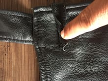 The only defect:Lose stitching on the accessory loop. 