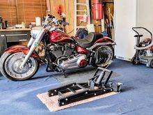 Keep it stored in the cubby hole left of the work bench.