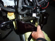 After  the bottom two bottom castle bolts are removed slide the cover off the fork legs.