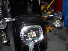 Putting the new HD turn signal relocation kit on back fender.