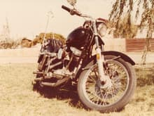1977 super glide  with a few mods. s u elimator carb, andrews b grind cam, black enron paint, straight pipes, drag bars, two piece seat. put a trian load of miles on this thing. saw deadwood s.d. along with sturgis and all the black hills.