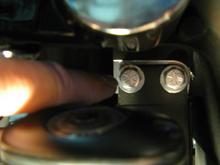 I installed the rear first as I read that was the hardest. Jacked up the bike and had to remove the muffs to gain access to the rear motor mount bolts. These two bolts need to be removed and re-installed in the opposite direction to mount the rear TT unit.