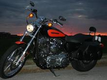 Dusk. Showing the saddle bags and small backrest I installed myself. The turn signal relocation was the hardest parts of that, but it was worth it. Took me about 4 hours total.