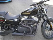 Drag bars with 6" riser, relocated speedometer, new light and assembly, flipped over mirrors, Progressive shocks, Hance and Vines Competition exhaust and fuel pack and a Screaming Eagle Stage 1 intake.