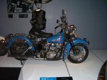 An old (48) pan that a guy rode for several hundred thousand miles then rode to Milwaukee and donated to HD, along with his vest and helmet. Horns included...