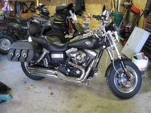 updated photo with saddlebags, windshield, 1 1/4" beach bar, nostalgic grips, skull collection accents,