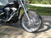 21x3.25 rim on stock hub 
120 tire fits under stock fender with no mods