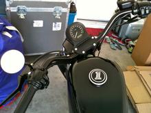 New dark custom gas cap cover and single 3" left side mirror.