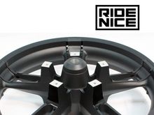 Shown with the Ride Nice Enforcer flush-mount ABS wheel spacer, powdercoated textured black to match.