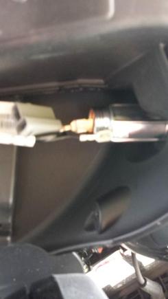 on the left was the stock wire connector, I just used a small dental pick spring hook and released the wires from it and sliped them on the cig lighter connectors. Fit right on. They are tight too. OEM was not water proof I figure the faring must protect em