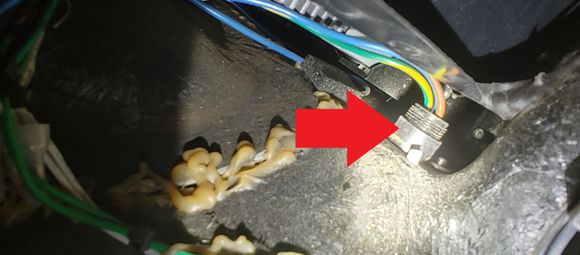 Brown cable goes down through fairing along with two battery cables