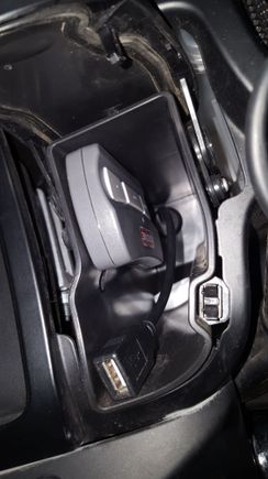 Velcro tape a garage door opener inside the cubby.