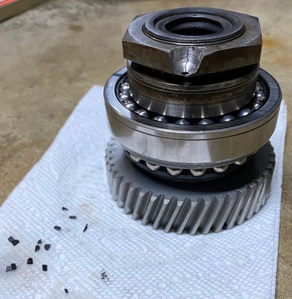 Plastic pieces broke off from the ball bearing cage when removing the bearing