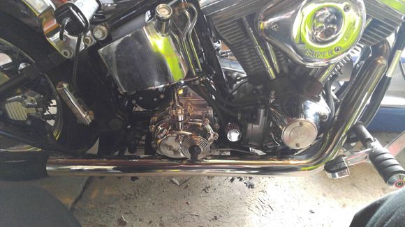 I had to dimple the front pipe to fit under the kicker housing.