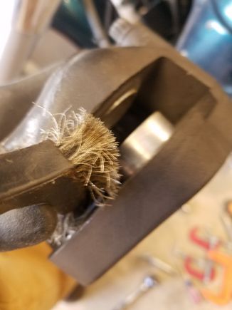 Use a wire brush and Brake-Clean to get all the crud off the piston. It should look nice and shiny after the brushing.