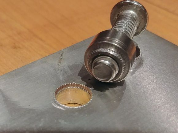 Insert came out with a few mild taps to the side of a fastener with a 6oz plastic mallet.