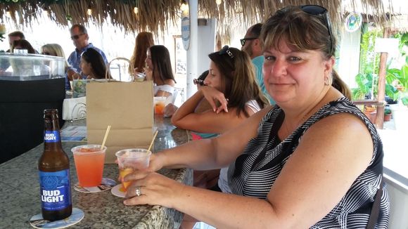 Suzie at the “Beach Bar” happy hour. Cheers folks!