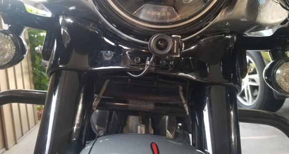 Fron view of front camera, not very noticable.  Lots of room so will not contact fender.  Good centered unobstucted view to front.