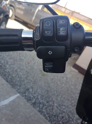 My extended turn switch,  no icon but it rocks in on the passing lamp switch.