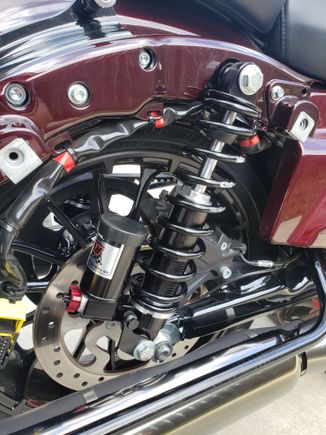 Not sure about the stockers but the RWD's I just put on had to be mounted upside down on touring bikes for bag clearance, seemed weird to me but I called RWD and they confirmed upside down was correct and has zero impact what so ever on performance.
​​​​​​​