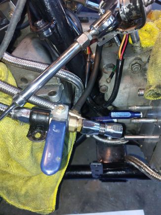 I use this Lowes bought ball valve to shut off the oil.  With the handle off and pointing out, It instantly gets in the way of my leg if I'm sitting, or using the kicker.  Pushing it forward opens the valve.  Doesn't leak a drop. Looks kind of Steam punk in my opinion. 