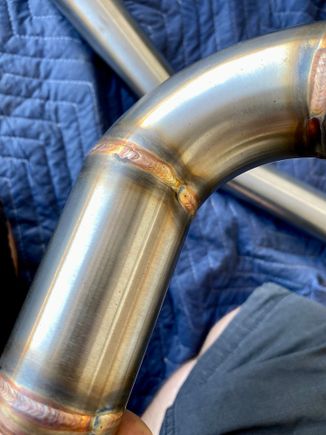 Overspray all over exterior of pipes (black speckles)