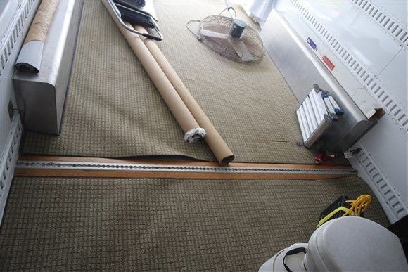 Surface mount I-Trac with oak ramps on each side of the I-Trac.