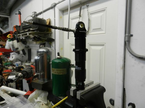 5. With the (#3) shaft,  piston nut, piston, and the seal head assembly inserted back into the shock body the shock is then re-charged with nitrogen.