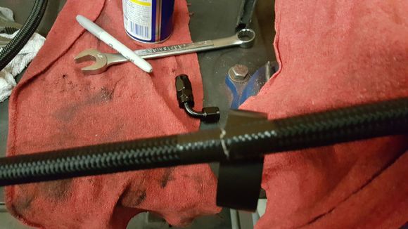 Use electrical tape - and tightly wrap on each side of the line to cut - tape keeps the shield from unraveling and becoming an unmanagable rats nest - that cannot be inserted into the hose end..., it also keeps wire secure and not sticking your finger - which hurts like hell