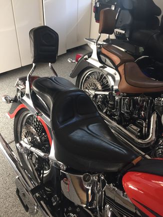 The Maverick Daddy Long Legs moves you back 2" (closest bike).  My seat has the passenger pillon which the wife loves.  The second bike has the Le Pera Bare Bones which you definitely don't want for long trips.  😂