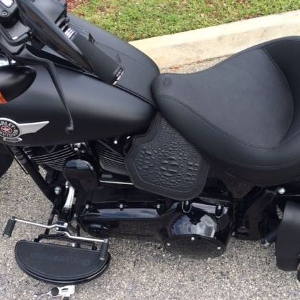 Heat shield with alligator embossed leather.