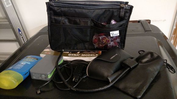 Medium bag that I put in the right saddlebags. It's thin enough that I put it toward the front of the defender bags where it's more narrow. Still a lot of empty space in the rest of the saddle bag. In this on I've got clear and extra glasses, phone charger stuff, sunblock, helmet lock, owners manual and fireballs.