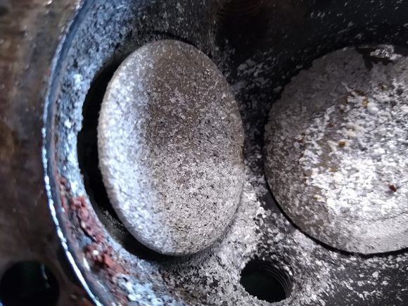 Exhaust valve stuck open with what was once molten aluminum from the piston I assume