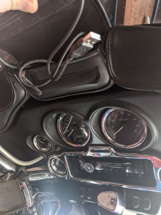 Here is what I did, hole through top of inner fairing into the bottom of my windshield bag.
