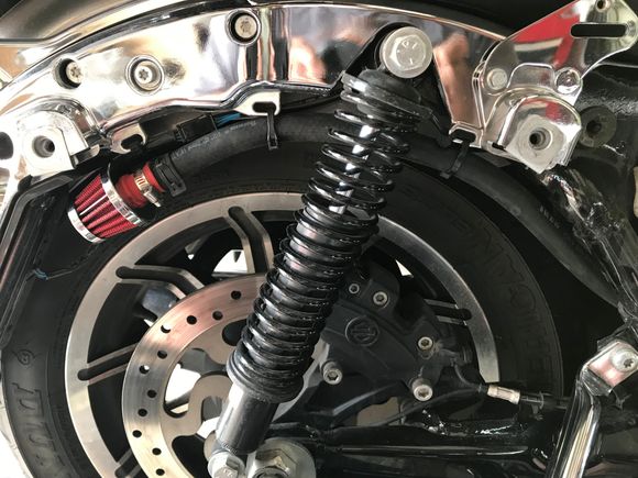 I routed the hose under the ABS module and tied to the fender struts. 