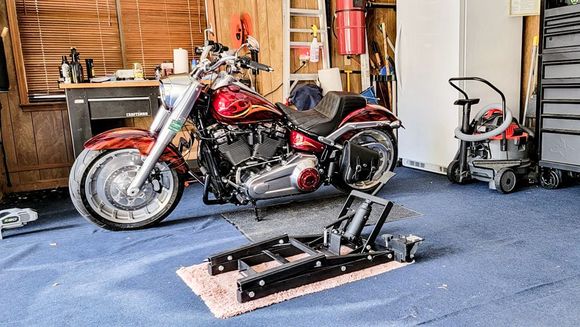 Keep it stored in the cubby hole left of the work bench.