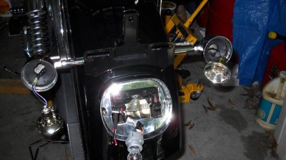 Putting the new HD turn signal relocation kit on back fender.