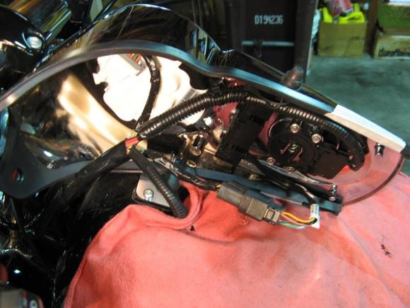 Remove two hold-down bolts and flip dash over on its side - be sure to use rag/cloth to protect tank.