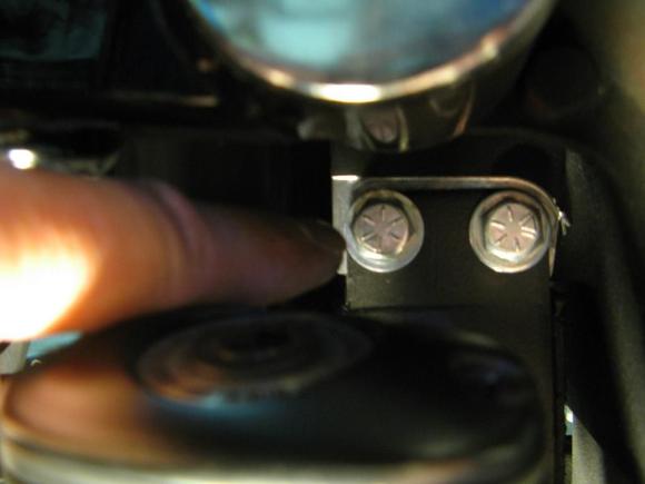 I installed the rear first as I read that was the hardest. Jacked up the bike and had to remove the muffs to gain access to the rear motor mount bolts. These two bolts need to be removed and re-installed in the opposite direction to mount the rear TT unit.