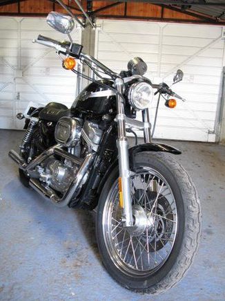 With beach bars fitted (looks fantastic), since removed. A bit too extreme for me. Puts too much rider weight forward and upsets handling making rear (more) skittish. These are now on ebay - ah well, it's a Harley so you have to try these things...