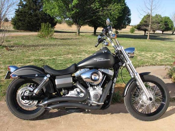 09 Street Bob w/HD bullet headlamp.  I think that nostalgic tail light and the bullet headlamp really balance out the front and rear of the bike.  Love the new headlight.