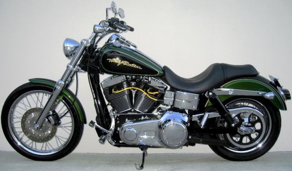 **Front End**
*H.D. 2006 Wide Glide 21" front wheel 
*H.D. Billet Fork Slider Dust Covers
*H.D. Chrome Lower Fork Sliders 
*H.D. Classic Chrome Brake Caliper Insert 
*Kuryakyn Front Axle Nut Covers 
*H.D. Tinted turn signal lenses 
*H.D. 2008 Screamin Eagle Dyna front turn signal mounts   
*H.D. 2006 Deuce headlight 
*H.D. 2006 Sportster Custom, headlight mount 

**Hand Controls**
*H.D. Aileron Hand Grips 
*Routed front frame and console wire harnesses to left side of the bike
*Redressed all harnesses, cables, and hoses
*Removed reflectors, all factory decals, VIN, and emissions labels, and vapor canister

**Engine**
*H.D. 10 Row Oil Cooler
*H.D. Screamin Eagle Yellow 10mm spark plug wires
*Home made spark plug wire supports
*Relocated horn 
*Installed banana jack on bottom of coil cover for battery tender

**Foot Controls**
*H.D. 2005 Forward control kit
*H.D. 2006 Polished Stainless Steel Gear Shift Linkage
*Removed the original shift lever without removing the primary
*H.D. 2007 Screamin Eagle Springer foot pegs 
*H.D. 2007 Screamin Eagle Dyna Polished Stainless Steel Footpeg Mounting Pins 
*Grinded down rear foot peg stops so pegs will tilt in more when in the up position

**Rear End**
*H.D. 2007 Street Glide Air Shocks
*Modified lower belt guard
*H.D. Script Rear Axle Cover Kit
*H.D. Tinted turn signal lenses 
*Custom Chrome lay down pyramid license plate mount 
*Kuryakyn Deluxe Smoked Tail Light
*Painted LED light face plate and inside of lens sides flat black