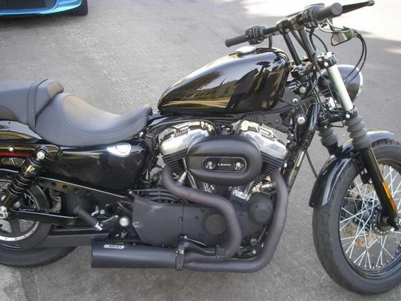 Drag bars with 6" riser, relocated speedometer, new light and assembly, flipped over mirrors, Progressive shocks, Hance and Vines Competition exhaust and fuel pack and a Screaming Eagle Stage 1 intake.