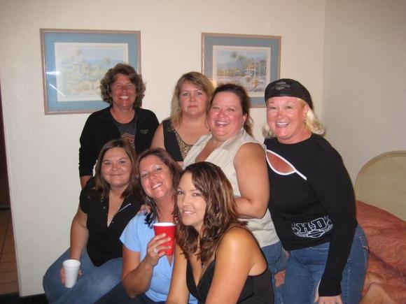 The girls in the room getting prepared to go PARTY.