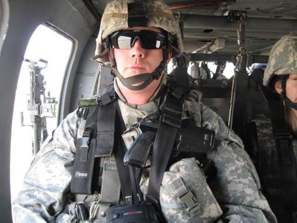 In a helicopter, escorting a patient to Baghdad