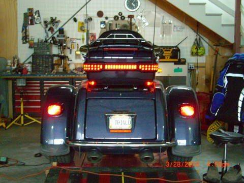 Believe it or not the brake light is in the center part, not on the corner parts. (tour pak lights)