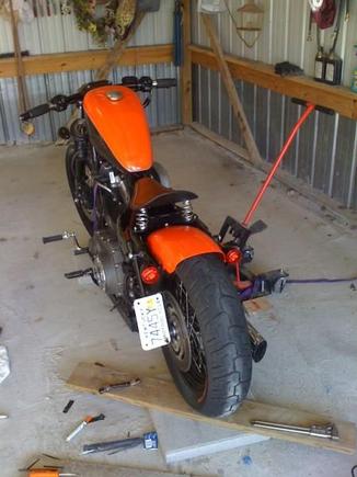 Back together. Legs off the turn signals and using them to hold up the fender. The license plate is mounted to the tensioner and bent slightly to flow with the strut. The light from the turn signal completely illuminates the license plate in this way.
