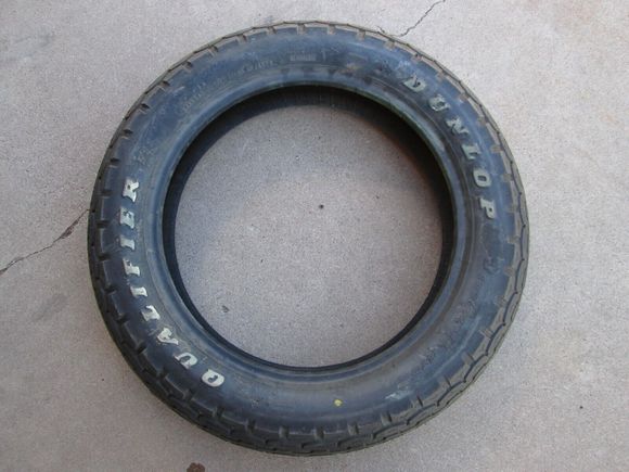 this tire looks like it still has the protective film/coating on the letters !