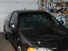this the best picture i could get of the car in the garage, carbon fiber hood and fenders with paint faded into them, 17" konigs previous owner put on