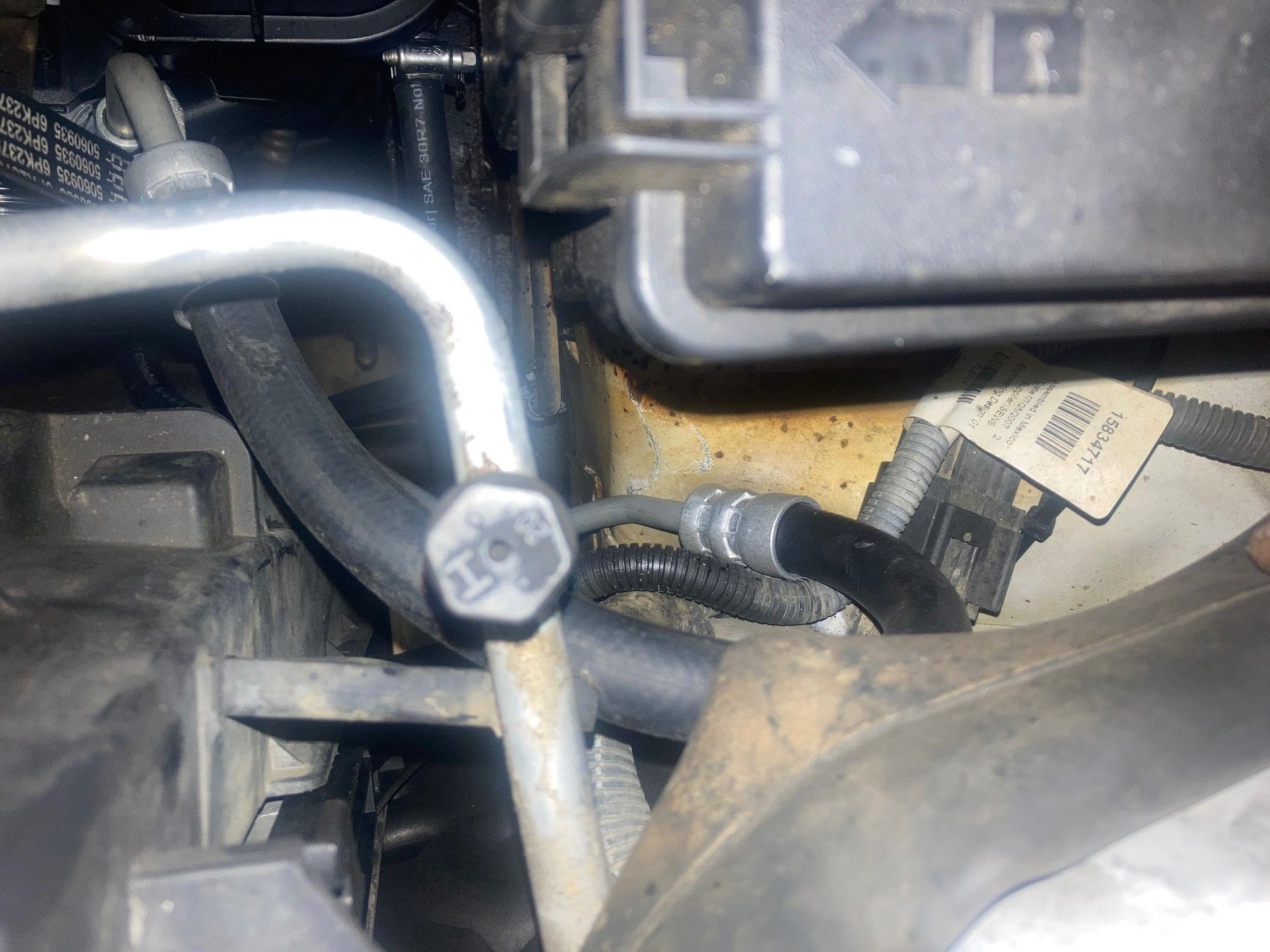 Excess hose by fuse box.  Don't mind the old battery vent hose.  
